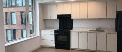 Kitchen at H1H2 with window and stove